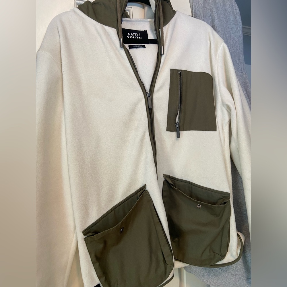 Native Youth zip up, fleece material size L, runs a little snug but very nice.